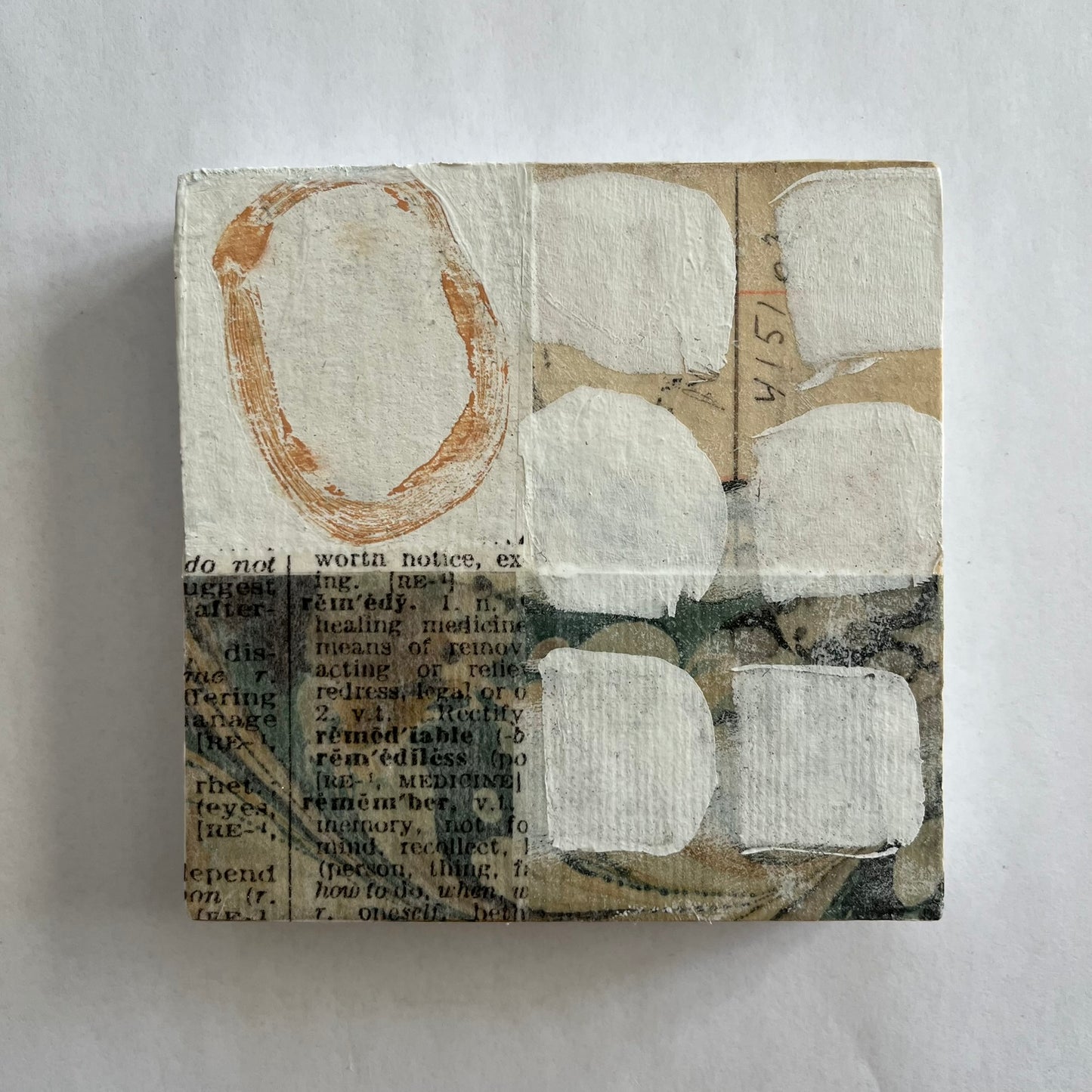 Collage on wood block C1